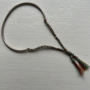 Silver cuff bracelet with braided tie